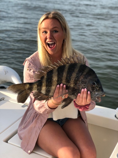 Blonde Woman Holding A Fish