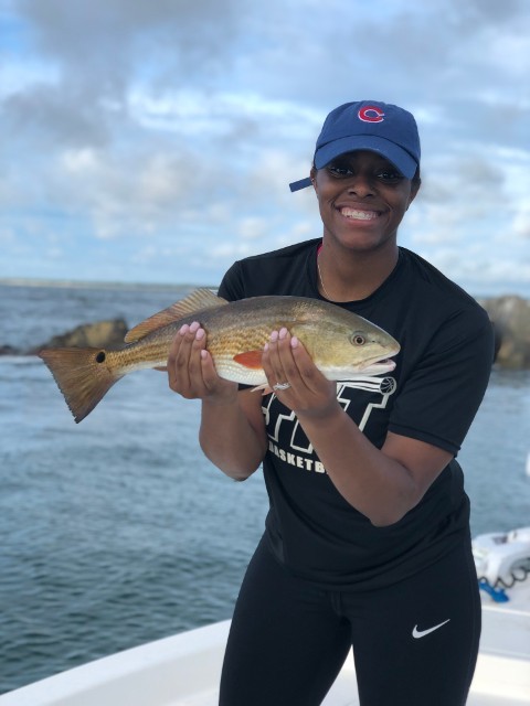 Man Holding A Large Fish