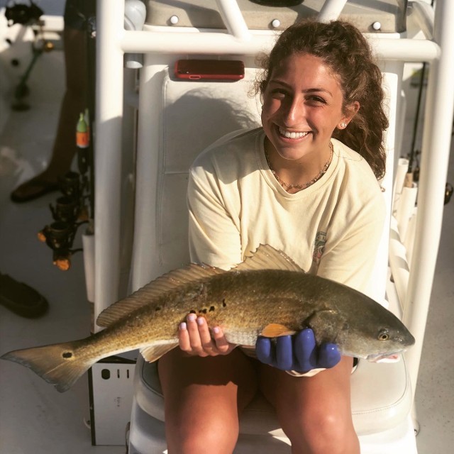 Woman Holding A Fish