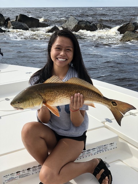 Happy Woman Holding A Fish