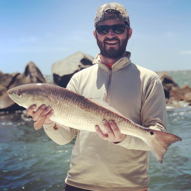 Smiling Man With The Fish He Caught