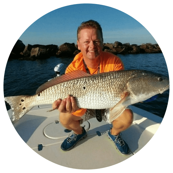 Man In The Middle Of The Ocean Holding A Fish