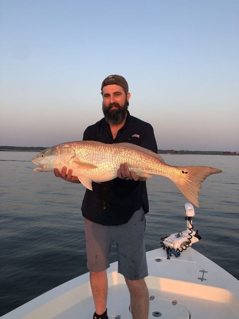 Bearded Man Holding A Big Fish