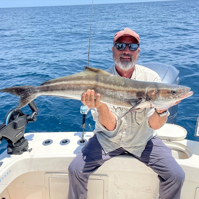 Elderly Man Holding A Big Fish