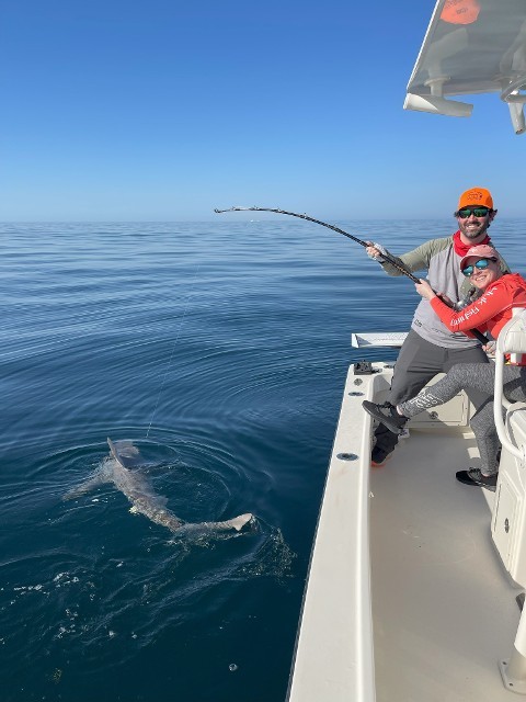 Happy Couple With A Shark