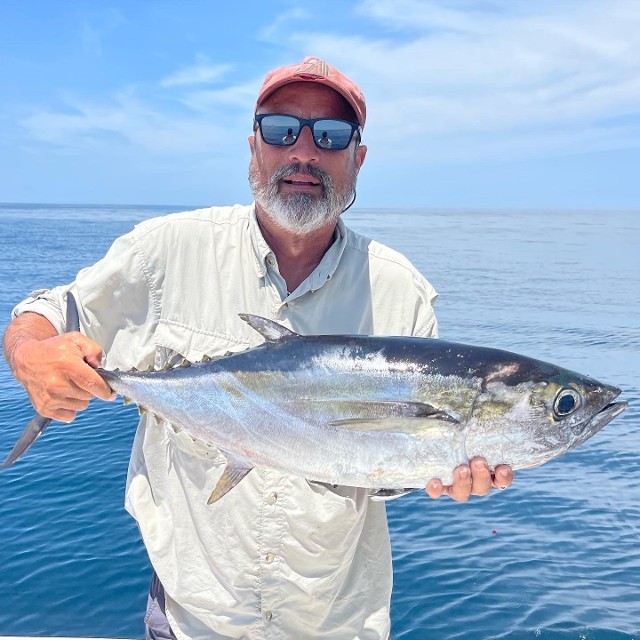 Old Man Holding Big Fish