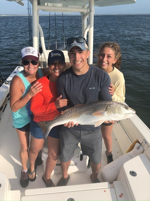 Four Individual Holding One Fish