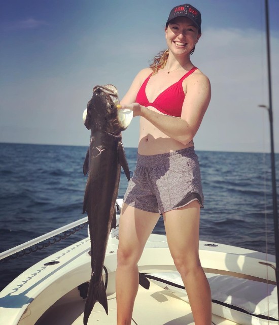 Woman Holding A Big Fish