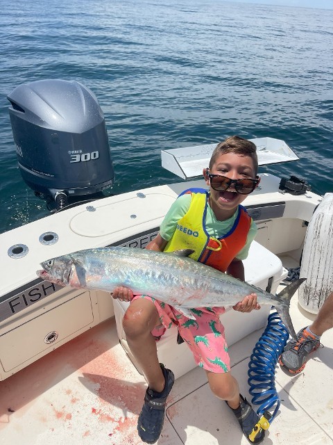 Young Boy Showing His Catch