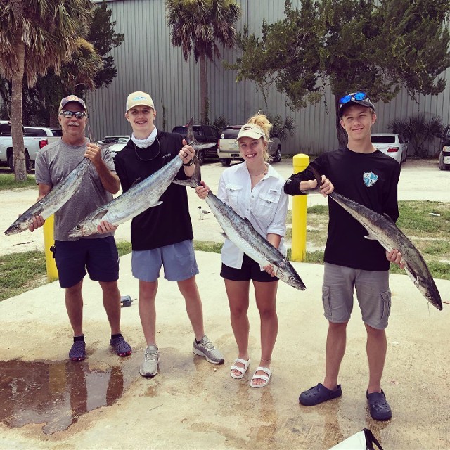 Small Families Holding A Fish