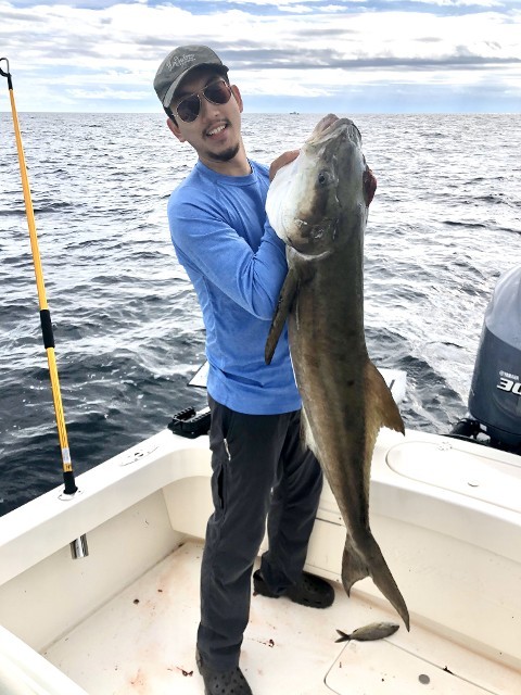 Man Holding Large Fish